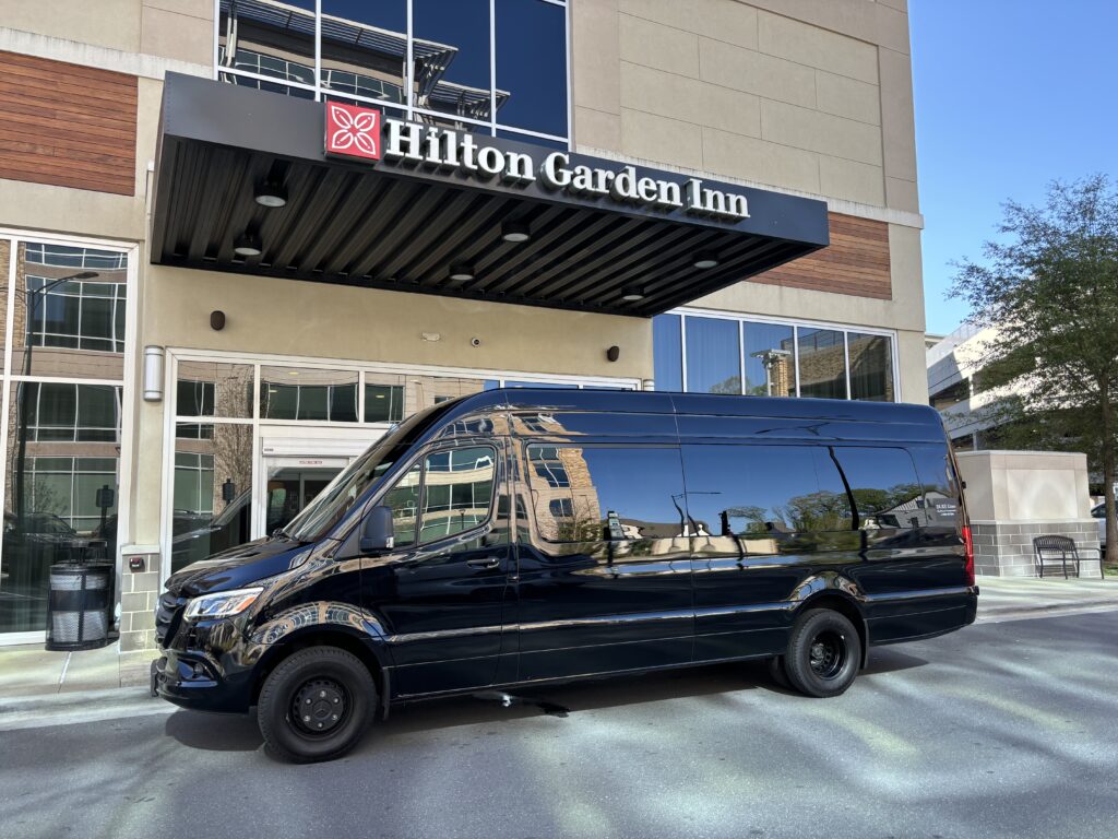 Charlotte airport transportation in Duke Limo Sprinter van parked at Hilton Garden Inn for hotel pickup