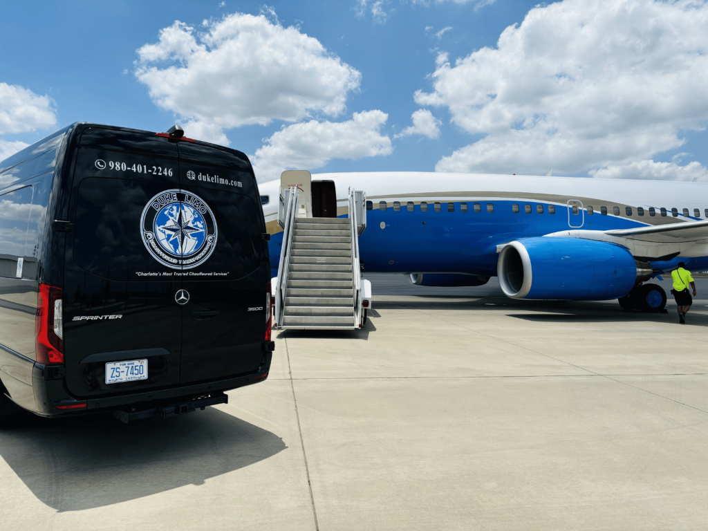 Duke Limo luxury Sprinter van positioned beside private jet on airport tarmac – exclusive VIP ground transportation service.