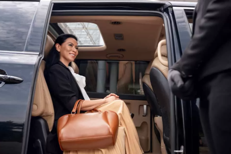 Passenger seated in luxury SUV for Charlotte airport transportation with Duke Limo chauffeur
