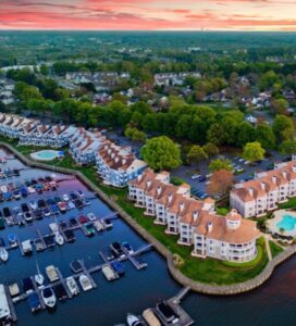 Aerial view of waterfront condos and marina in Cornelius, NC at sunset — ideal destination for luxury travelers using Cornelius NC Limo Service.
