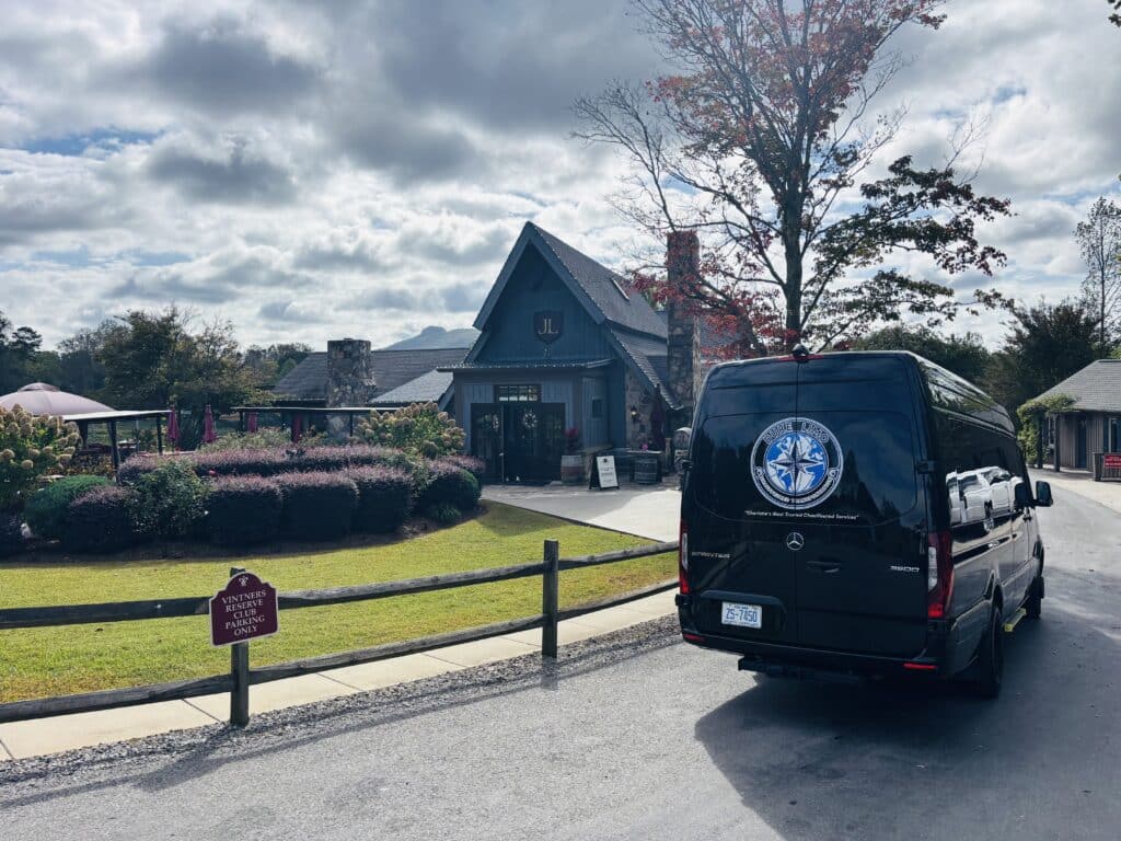 Duke Limo Mercedes-Benz Sprinter parked outside a North Carolina winery tasting room, ready for a wine-tour pickup.