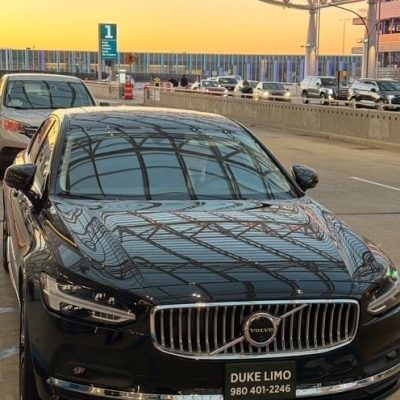 Luxury black Volvo sedan from Duke Limo providing Charlotte airport car service at CLT terminal