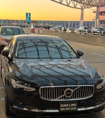 Luxury black Volvo sedan from Duke Limo providing Charlotte airport car service at CLT terminal